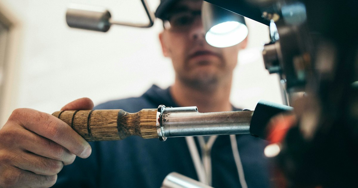 Plumber working on a residential water heater repair